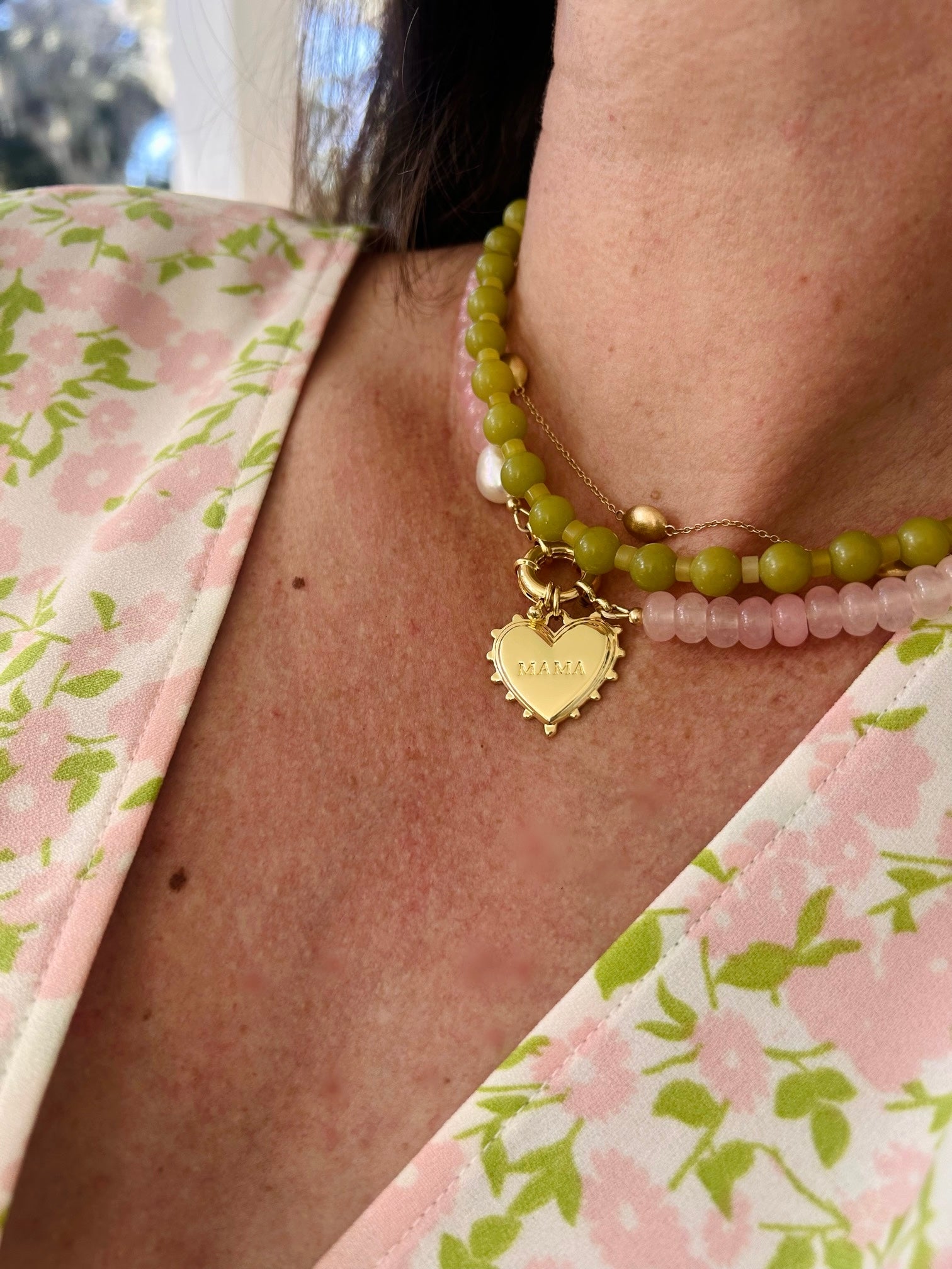 gold charm that says mama on it 